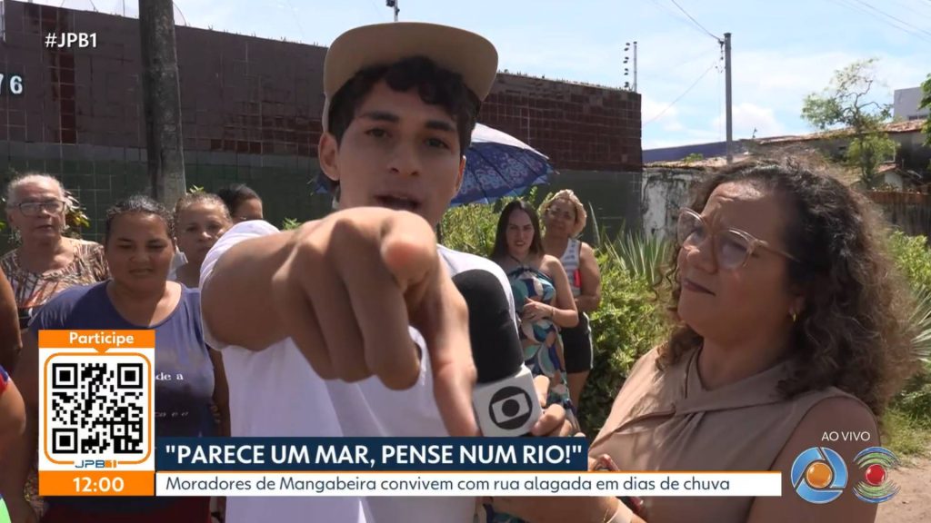 video:-morador-se-joga-em-poca-de-lama-durante-reportagem-do-calendario-jpb
